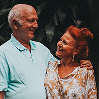 older couple looking at each other smiling